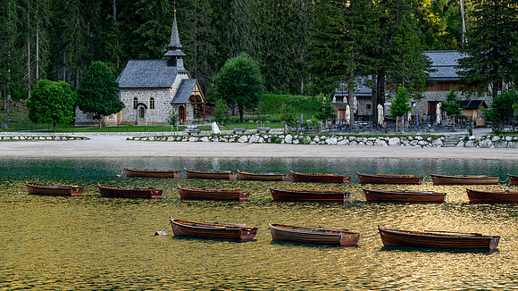 chapel and boats at sunrise