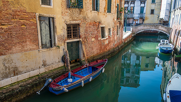 Small boat moored in a canal in Venice